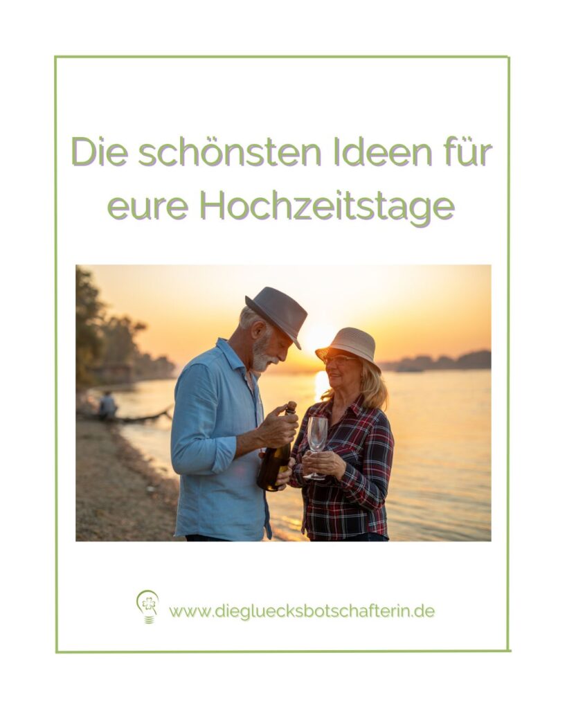 ein Paar feiert am Ufer seinen Hochzeitstag mit einer Flasche Sekt